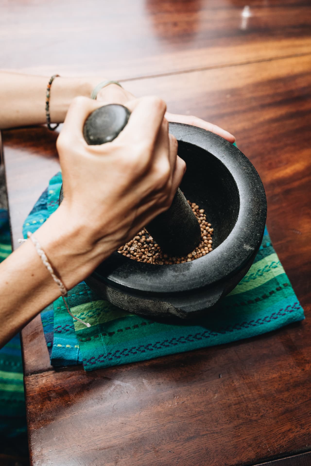 Grinding herbs with a mortar and pestle