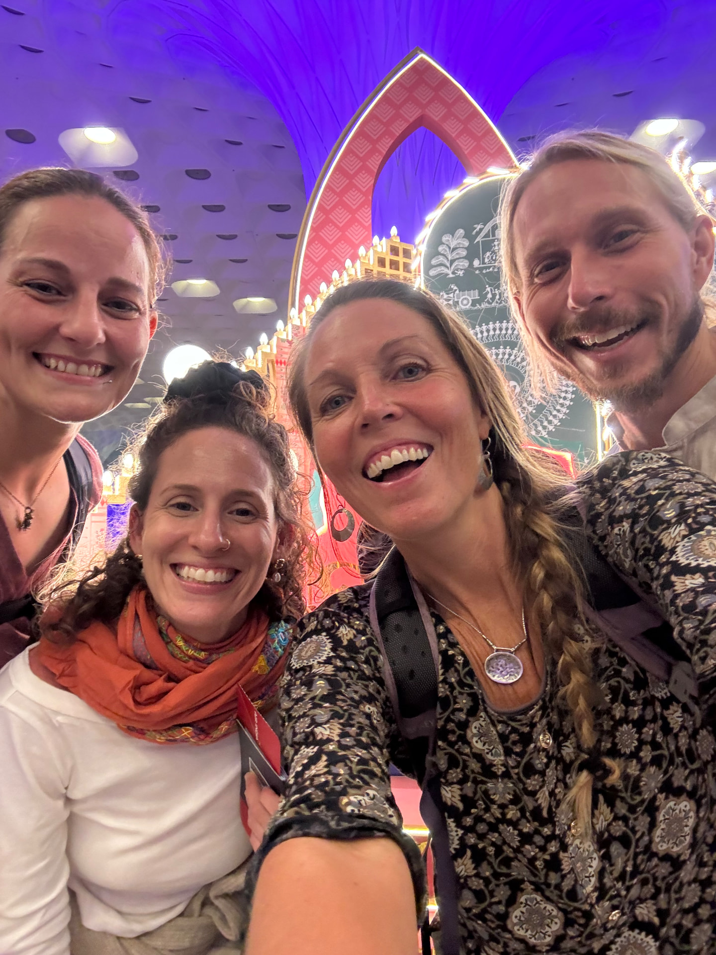 Students together at an evening festival pandal