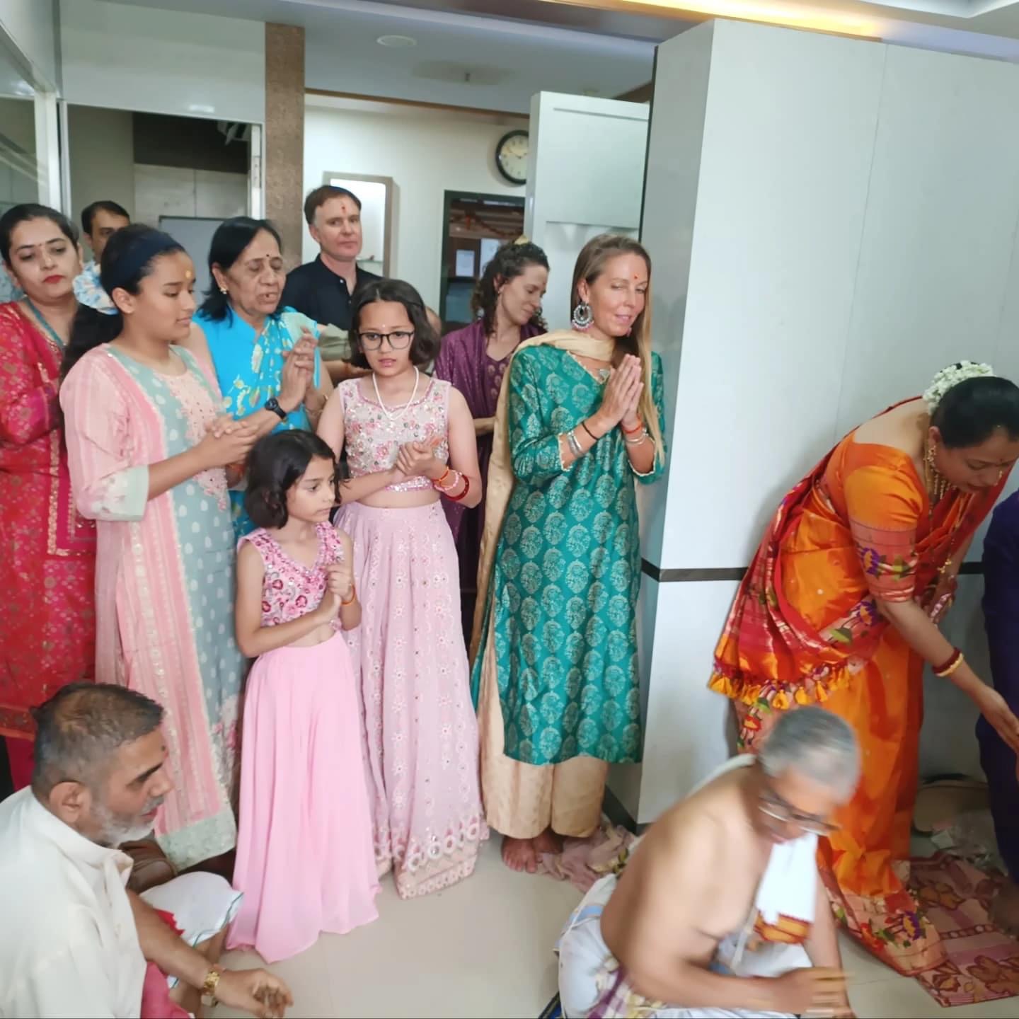 Students joining a family puja in India